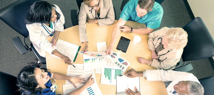 group of clinicians around a table