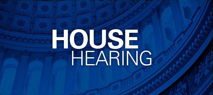 blue background with white text that says "House Hearing"