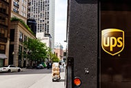 UPS truck delivering packages on an urban street