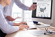 Gain Insight, Take Action with AHA’s New Data Viz Tool. Two users looking at a data map visualization in MetricVu.