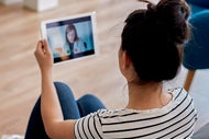 AHA, AVIA Launch Assessment for Behavioral Health Digital Strategy. A patient talks from home with a clinician via a telebehavoral health app.