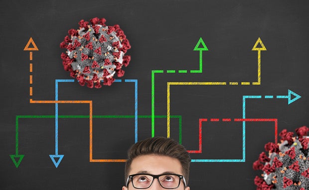 Forecasting Shifts in Strategic Priorities amid COVID-19. A man looking up at a strategy map that shows paths around the Coronavirus.