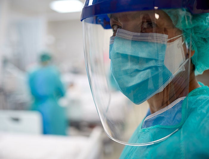 Utah nurse with face shield and mask on.