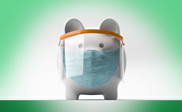 Will You Be Ready for the Post-COVID-19 Financial World? A piggy bank with a face shield and surgical mask on its face.