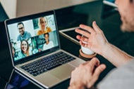 Virtual Platform Offers Gathering Place to Discuss Pandemic Response. A man connects with other AHA Living Learning Network through a video chat app on his laptop computer.