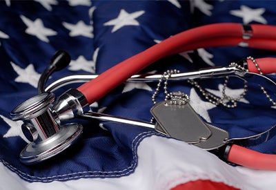 dog tags and stethoscope on US flag