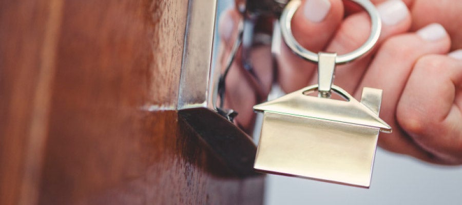 Housing and Health Banner Person putting key in door