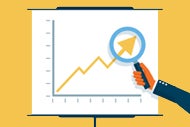 Predictive Modeling Could Create Better Sightlines to Forecast Finances. An graph going up to the right with the arm in a suit jacked holding a magnifying glass over the upper ward pointing arrowhead at the top of the graph.