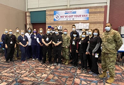 Group shot of AtlantiCare staffers and National Guard members