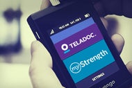 Teladoc’s Latest Offering to Integrate Behavioral Health. A user holds a phone displaying the Teledoc behavioral health telehealth app.