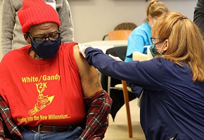Older black patient gets vaccinated Allegheny vaccination site