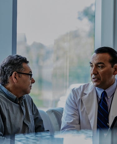 A doctor talking to a patient