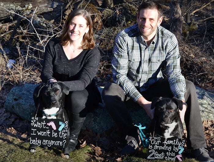 Geisinger nurse informatician Jana Kass and her husband Dan Landesberg, an associate vice president at Geisinger, and their dogs in a pregnancy announcement photo