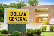 Will Dollar Stores Become a Health Care Destination? A Dollar General store with a Dollar General sign out front and a sign on the building.