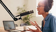 woman with podcast microphone