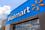 Walmart Hires Ochsner Exec to Lead Health Care Push. Walmart sign on one of its stores.