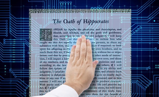 Is It Time to Develop a Digital Hippocratic Oath? A physician's left hand hand is raised toward a digital display of the Oath of Hippocrates.