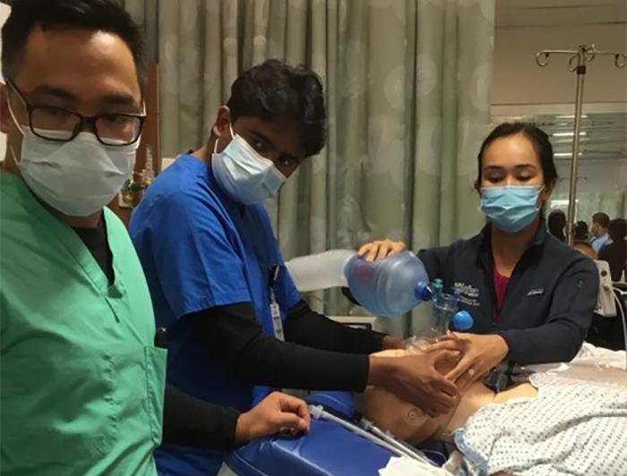 health workers practice on dummy