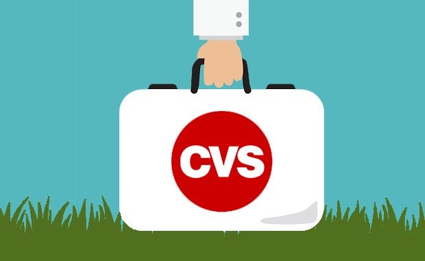 CVS Health Adds Home Health Services. What’s Next? The arm of a doctor is shown carrying a medical bag with the CVS logo on it.