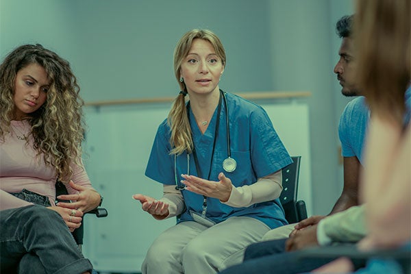 nurse leading a group couneselling session