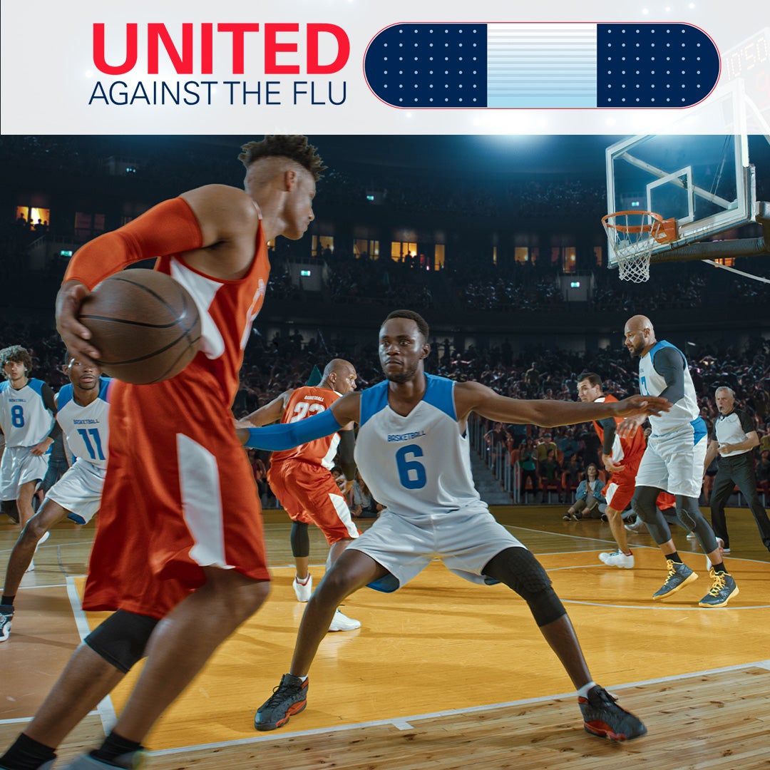 united against the flu logo above image of basketball player in blue and white jersey playing defense against player in red and white jersey dribbling ball