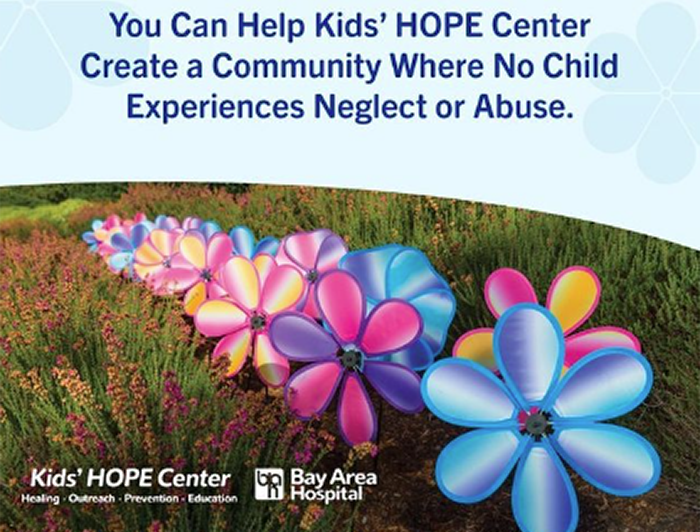 Poster of pinwheels planted in a garden. Text: You Can Help Kids' HOPE Center Create a Community Where No Child Experiences Neglect or Abuse