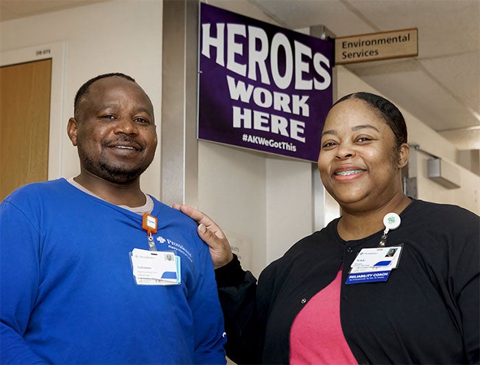 Providence Alaska Medical Center. Participant in RAIS program stands in hallway with another PAMC employee