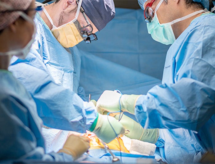 Stock photo of surgeons in operating theater