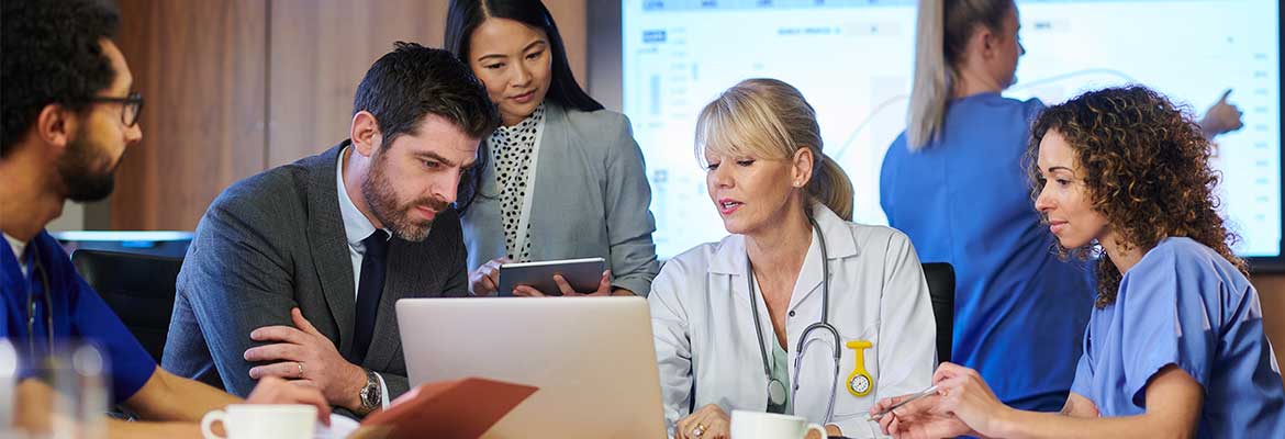 AHA Funded Partnerships | Medical people sitting around a table