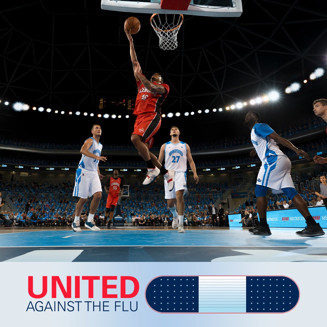 united against the flu logo below image of three basketball players in white jerseys standing around a player in red jersey making a jump shot