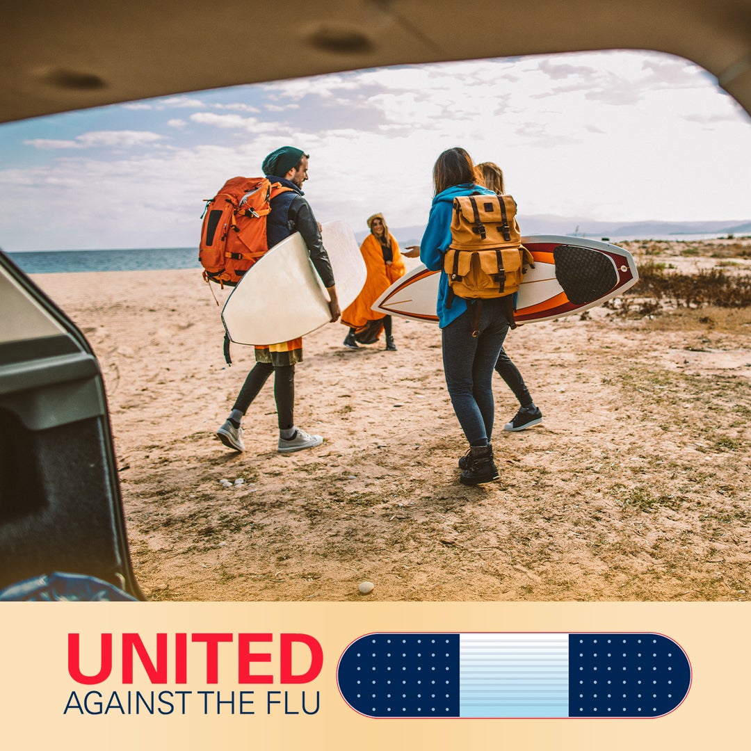 united against the flu logo below image of four surfers on beach with backpacks and boards