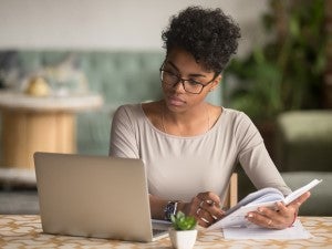 Young woman studies for leadership workshop