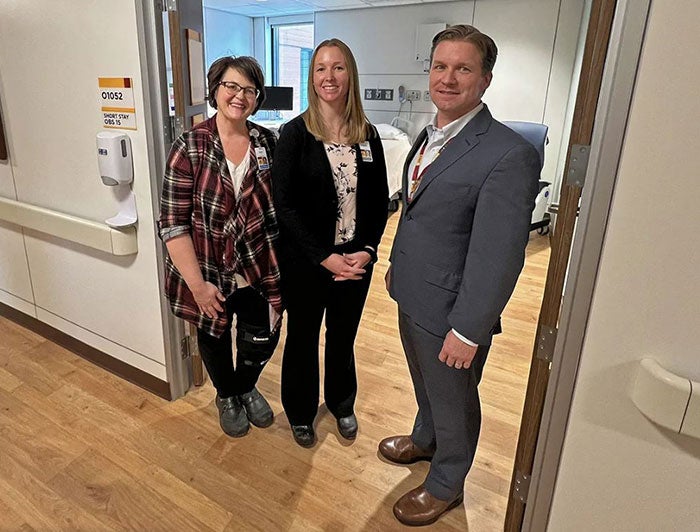 M Health Fairview St. John's Hospital team stands at entrance to new unit