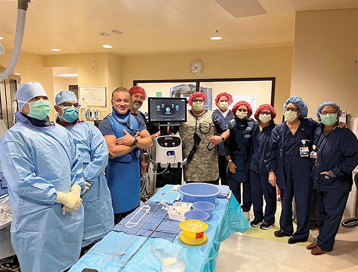 St John's Caramillo cryoablation team poses for phot in operating room