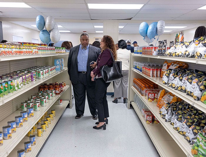 Texas Health Resources. A man and woman stand in the aisles of the on-campus store.