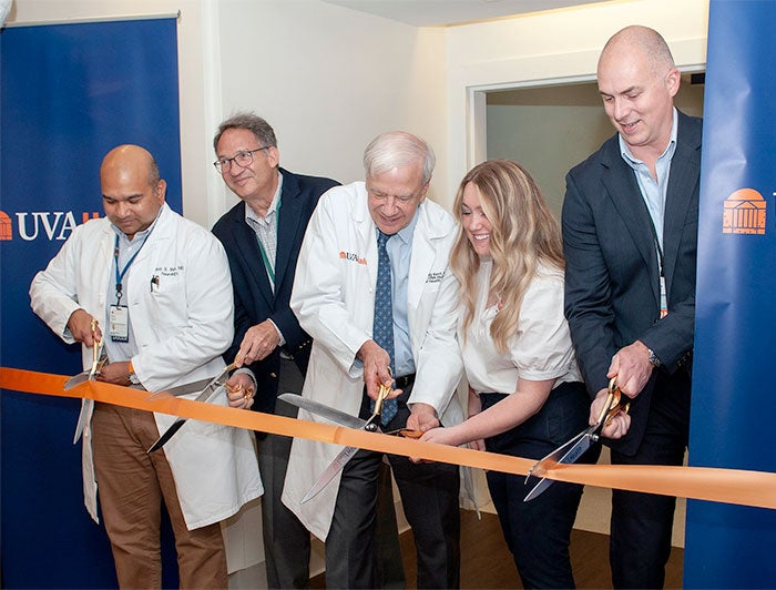Executives and clinicians cut the ribbon on UVA Health's new Parkinsons clinic