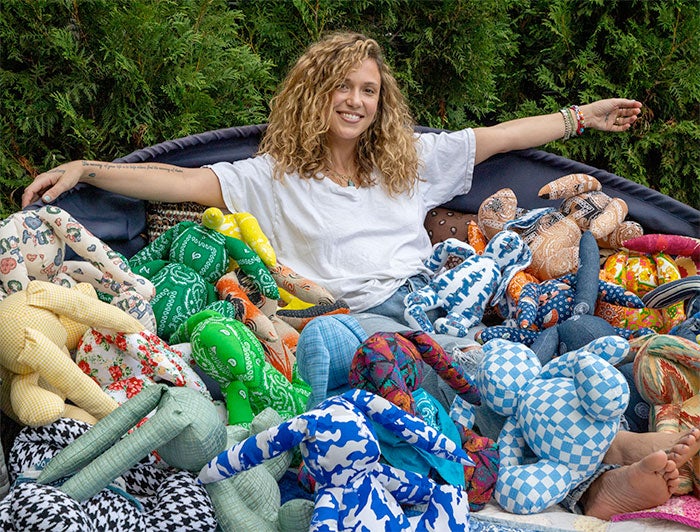 UK Healthcare. Caroline Bentley Noble sits amid a pile of her bunnies