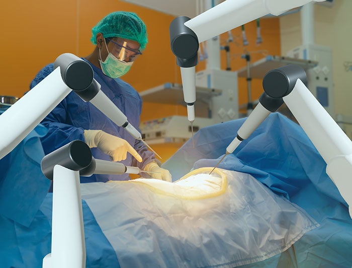 St. Joseph’s Hospital and Medical Center. Surgeon operates with robotic medical device