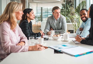 People gathered around a conference table