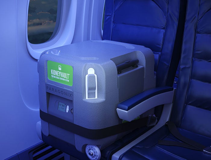 Vanderbilt Health. KidneyVault device shown strapped into a commercial airplane seat