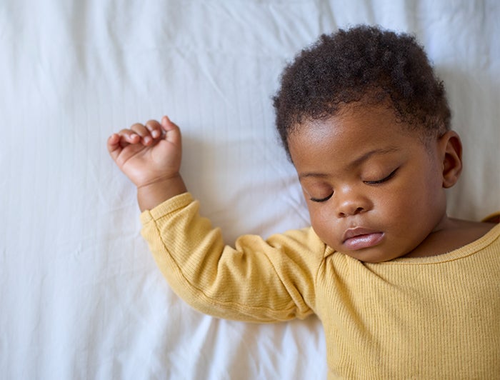 SSM Health St. Mary's Hospital, St. Louis combating state's high infant mortality rates through Infant Safe Sleep Program. Stock photo of a baby sleeping peacefully.