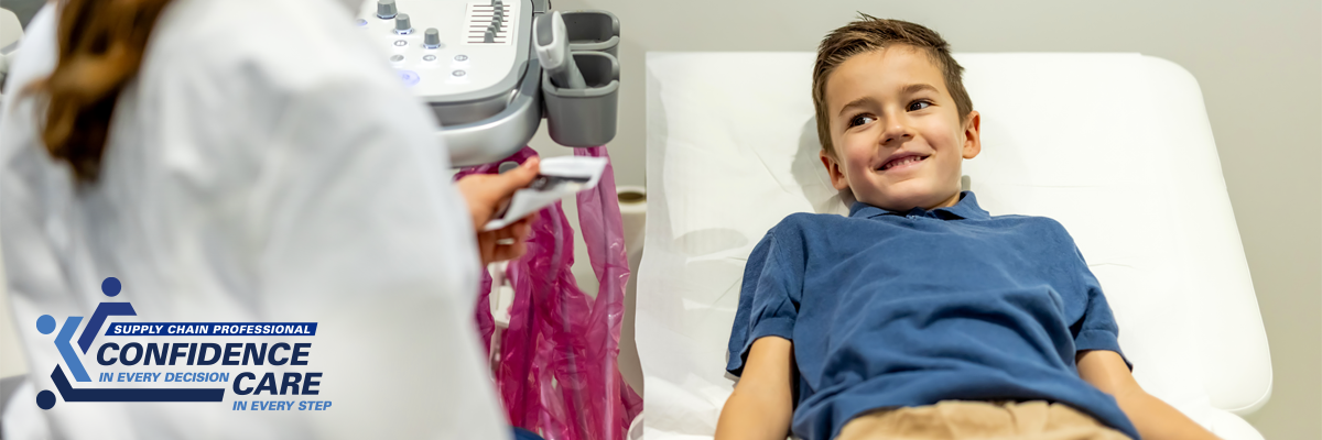Pediatric patient smiling on hospital bed 