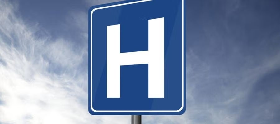 Blue hospital H street sign.