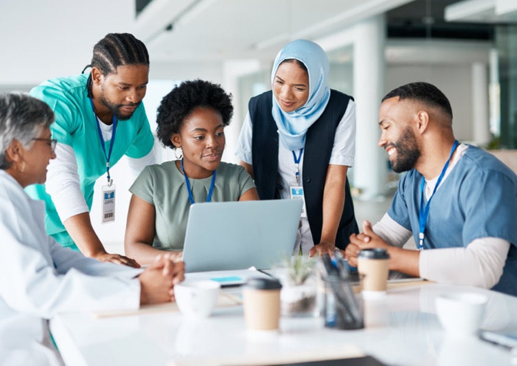 Medical staff gathered around a table