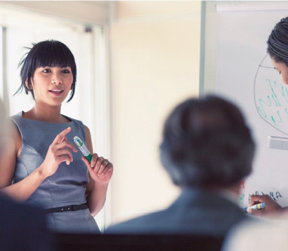 Female instructor presenting to people