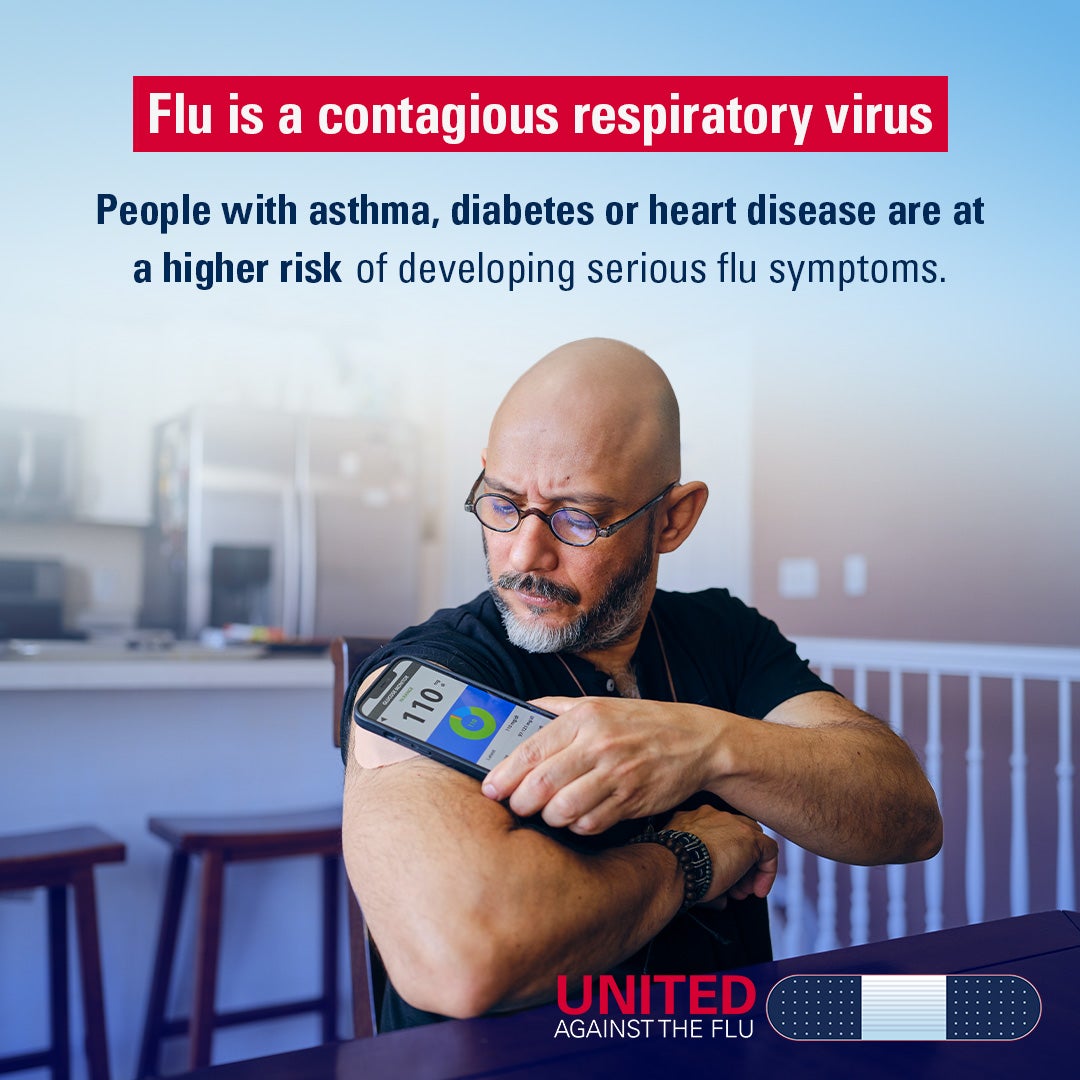 A man scans his glucose monitor with his smartphone. Text: Flu is a contagious respiratory virus. People with asthma, diabetes or heart disease are at a higher risk of developing serious flu symptoms. United Against the Flu