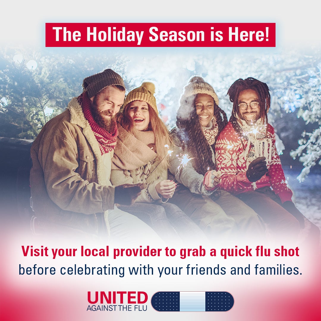 Two young couples wearing winter outerwear sit together outside on a cold night holding sparklers. Text: The Holiday Season is Here! Visit your local provider to grab a quick flu shot before celebrating with your friends and families. United Against the Flu