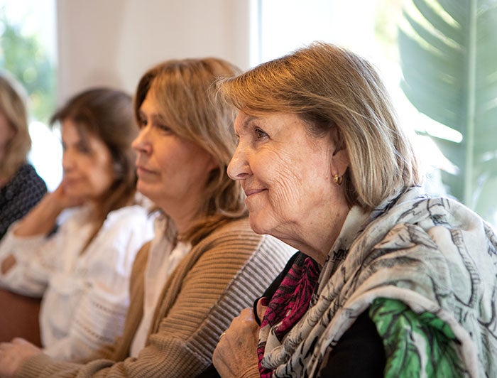 older woman sat in a row