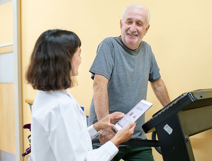 a man walks on a treadmill during a cardio stress test