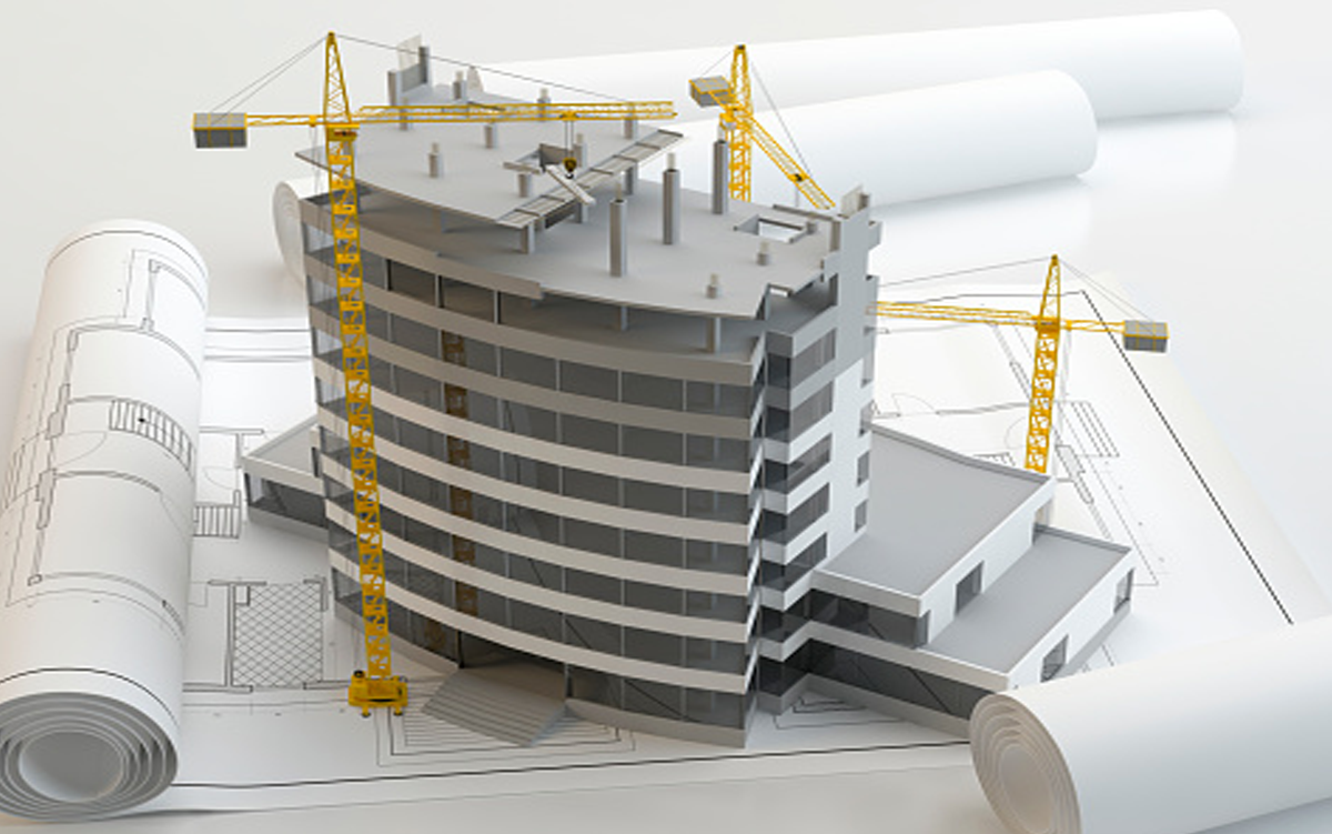 4 Experience-Enhancing Hospital Design Strategies. A hospital facility modern in mid construction sits on blueprints of the facility.